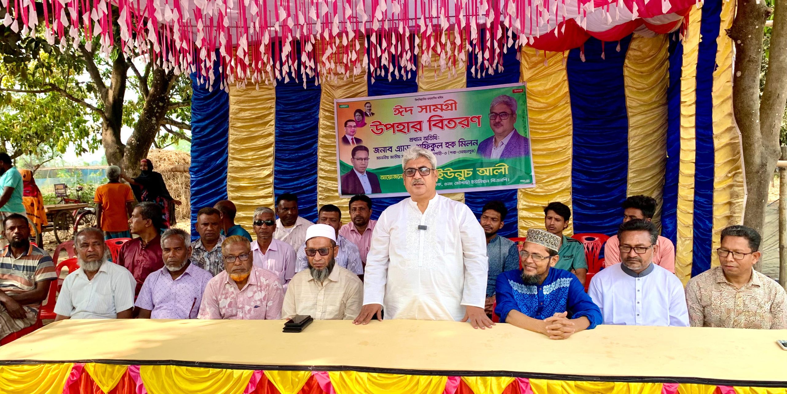 পবা ও মোহনপুরে অসহায়দের মাঝে ঈদ সামগ্রী বিতরণ করলেন এমপি মিলন